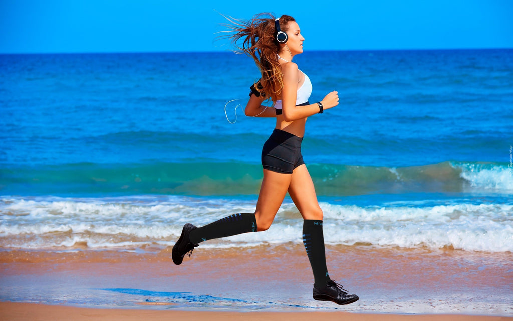 Brooks running shoes and CEP compression socks, legs female runner run  marathon in city, summer sports race Stock Photo - Alamy